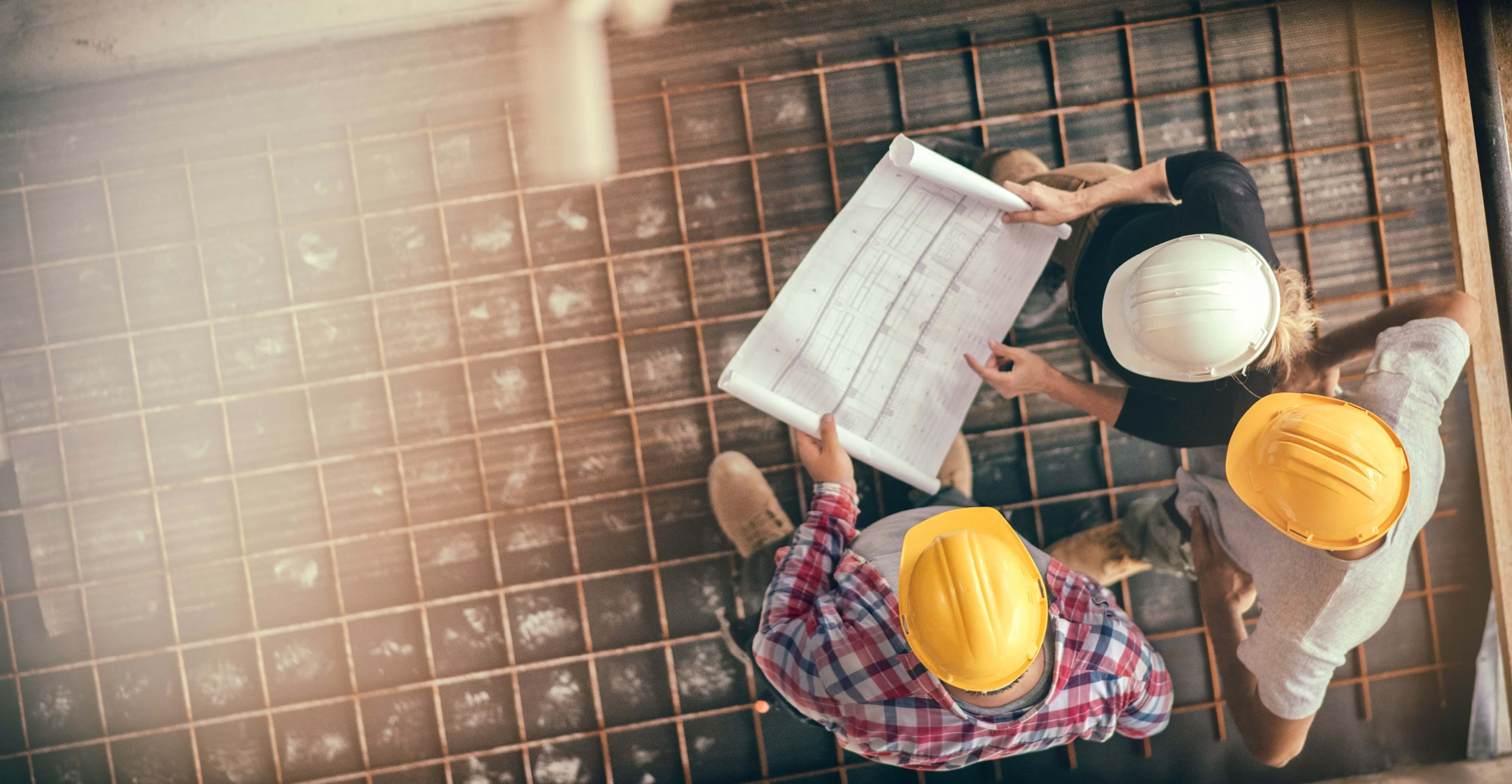 Construction workers looking at building plans